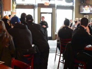 Coach Mel Pearson talks with team members and supporters in St. Paul - MTU Image