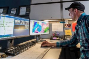 Ben Hodges, transportation maintenance supervisor at MDOT’s Grand Ledge garage, checks on plow location information, pavement and weather data in the maintenance decision support system (MDSS) during a winter storm in February 2016. (MDOT photo)
